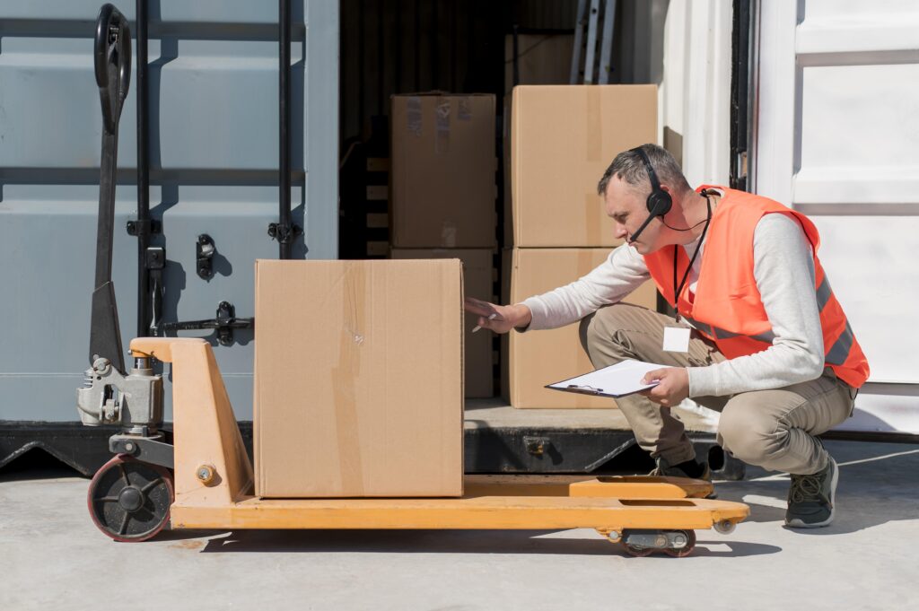 full shot man with pallet truck
