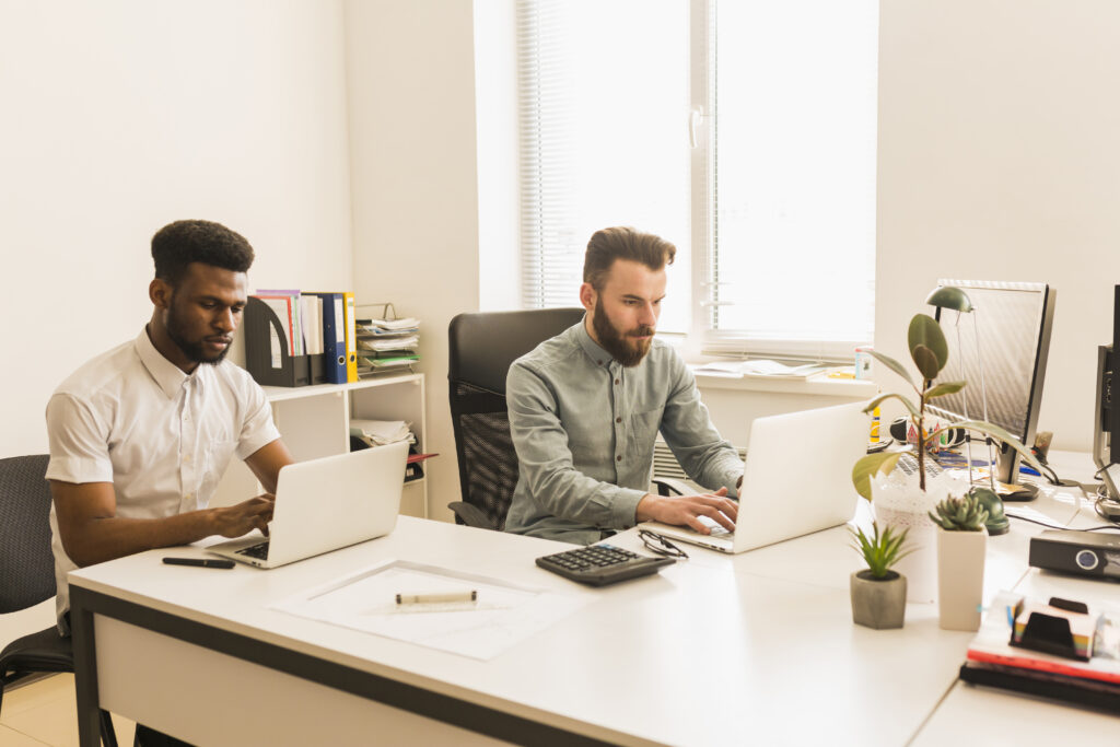 men working laptops