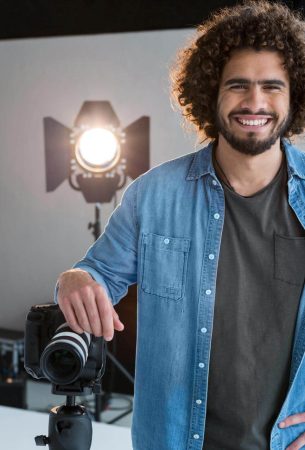 happy-male-photographer-standing-in-studio-2025-04-04-11-20-04-utc.jpg